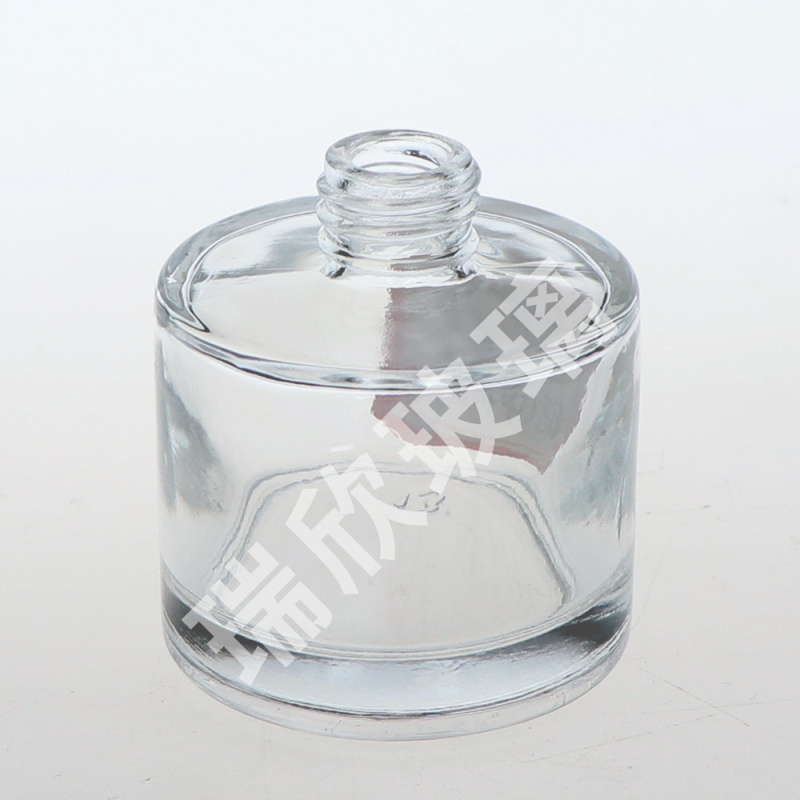 Diffuseur de roseaux de bouteille en verre de type rond de 100 ml avec capuchon à rouleau